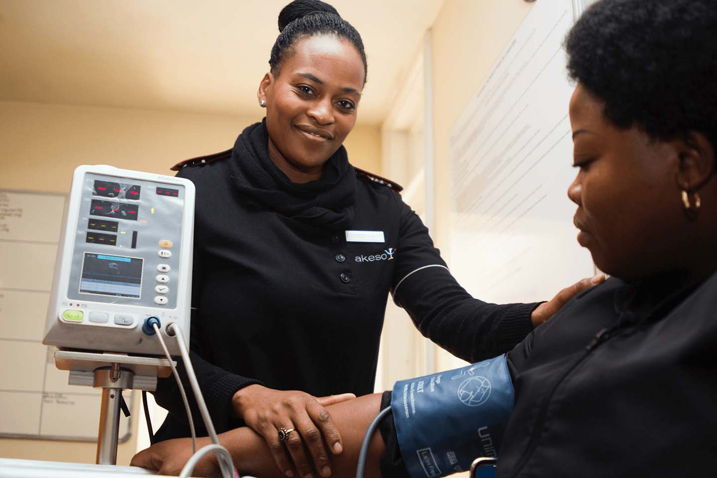 Nurse performing a healthcare blood pressure test on patient